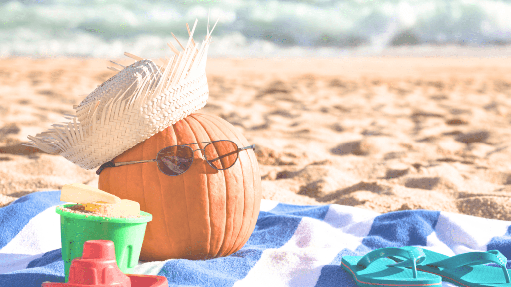 pumpkin on the beach with flip flops